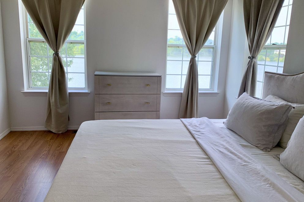 JWguest Condominium at Middletown, New York | Serene master bedroom with a lakeview | Jwbnb no brobnb 3
